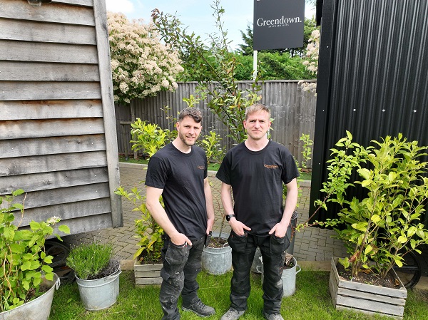 Harry Long, MD of Greendown Shepherd Huts and his newest apprentice, his younger brother Dan Long (camera right)